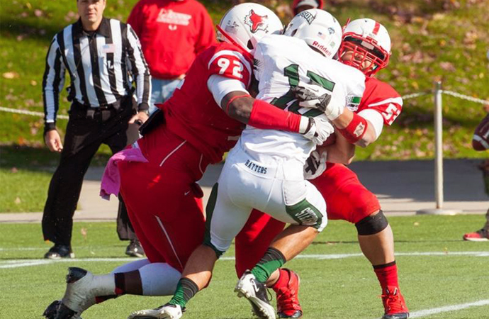 Marist's Terrence Fede (left) and Chris Katerianakis team up for a sack against Stetson, Saturday. (Photo courtesy Marist Athletics)